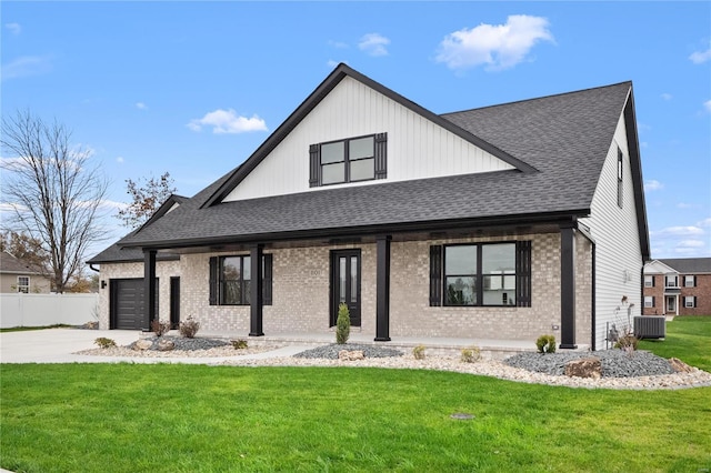 modern farmhouse style home with cooling unit, a front lawn, a porch, and a garage