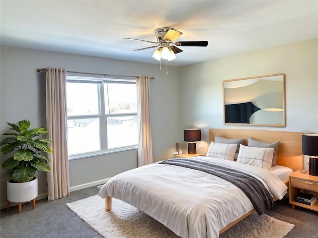 carpeted bedroom with ceiling fan and multiple windows