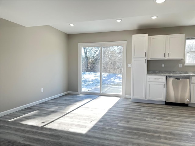 kitchen featuring wood-type flooring, white cabinets, and dishwasher