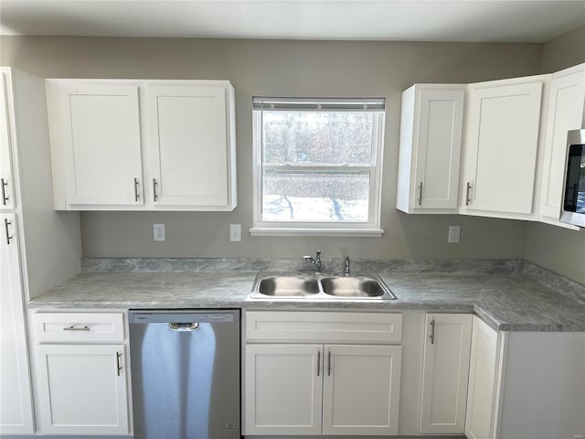 kitchen featuring white cabinets, sink, and stainless steel appliances