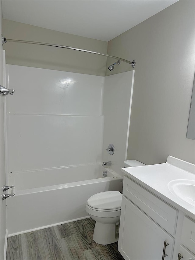 full bathroom featuring toilet, vanity, and bathtub / shower combination