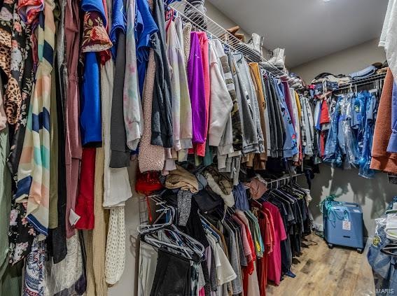 walk in closet featuring light hardwood / wood-style floors