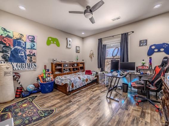 bedroom with hardwood / wood-style flooring and ceiling fan