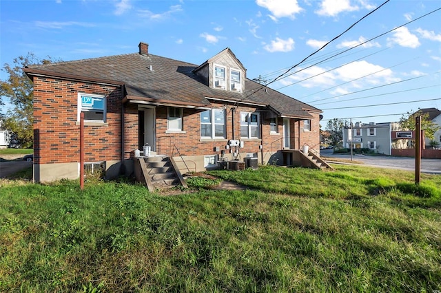 view of front of house featuring central AC unit