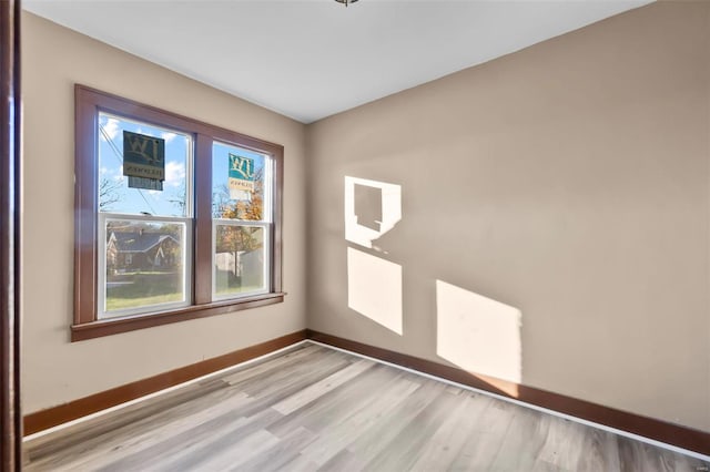 spare room featuring light hardwood / wood-style floors