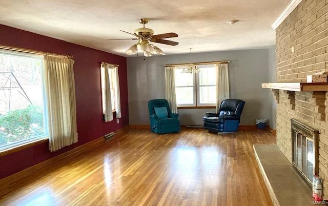 unfurnished room with a fireplace, hardwood / wood-style flooring, and ceiling fan