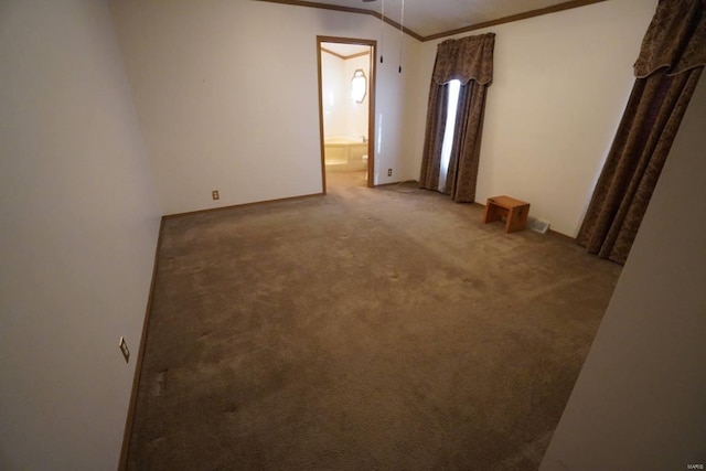 carpeted spare room with crown molding