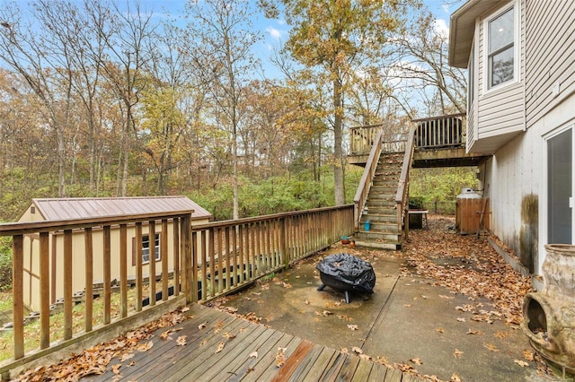 wooden deck featuring an outbuilding