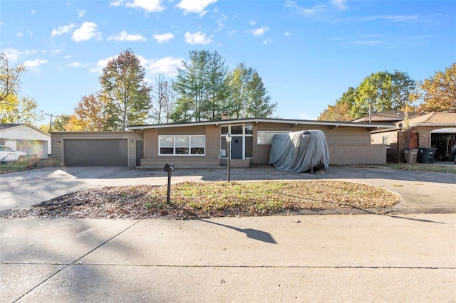 single story home with a garage