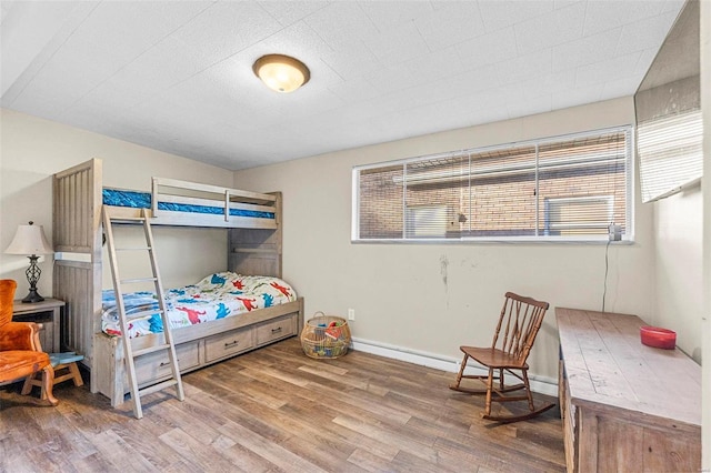 bedroom with wood-type flooring