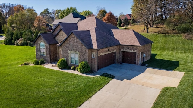 view of front of property with a garage and a front yard