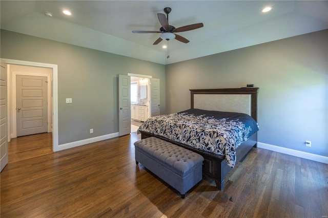 bedroom featuring ceiling fan, dark hardwood / wood-style floors, and connected bathroom