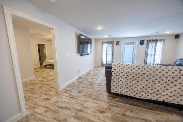 unfurnished living room with light hardwood / wood-style flooring