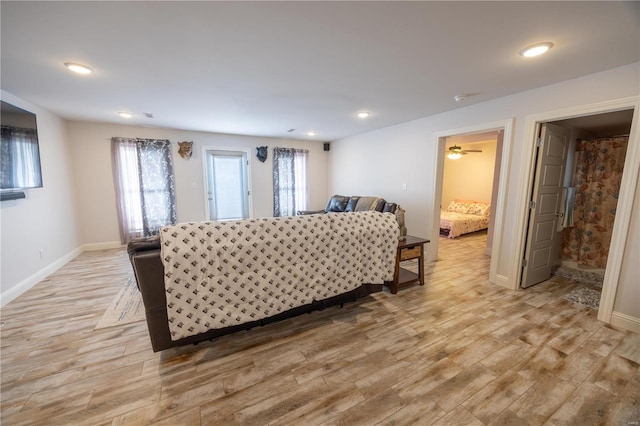 bedroom featuring light wood-type flooring and multiple windows