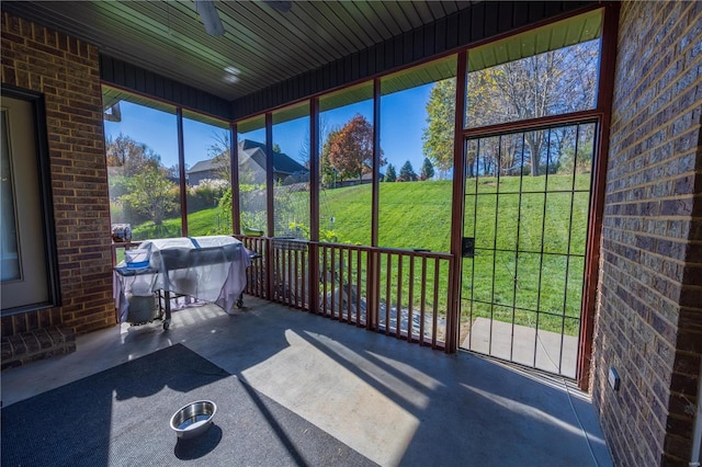 unfurnished sunroom with a mountain view