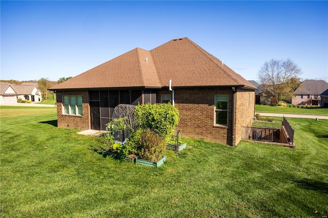 rear view of house with a lawn