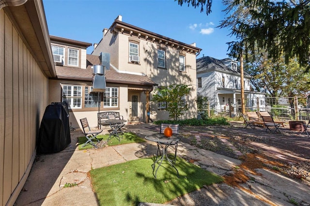 back of property with a patio and cooling unit