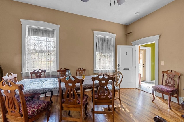 dining space featuring hardwood / wood-style flooring and ceiling fan