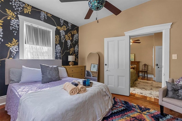 bedroom with ceiling fan and wood-type flooring