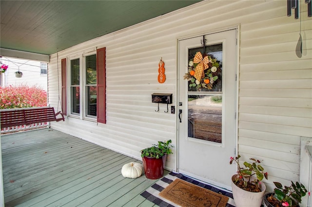 doorway to property featuring a porch