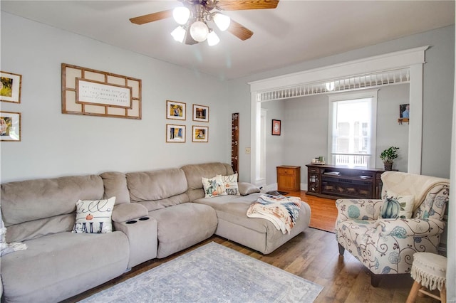 living room with ceiling fan and wood-type flooring