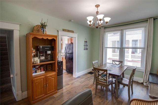 dining space featuring a chandelier and hardwood / wood-style floors