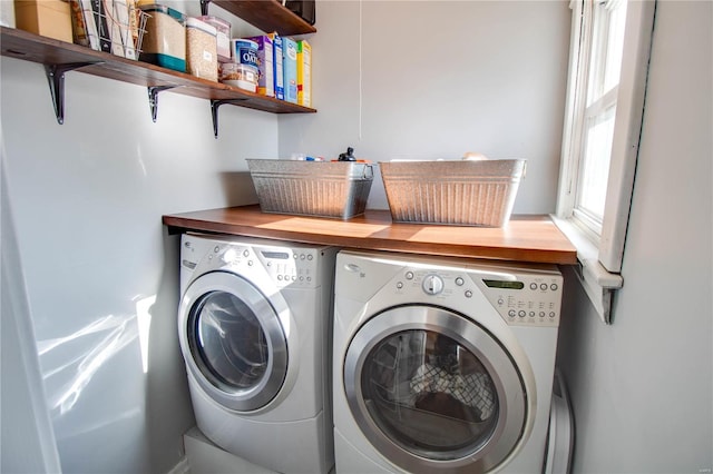 laundry area featuring washing machine and clothes dryer