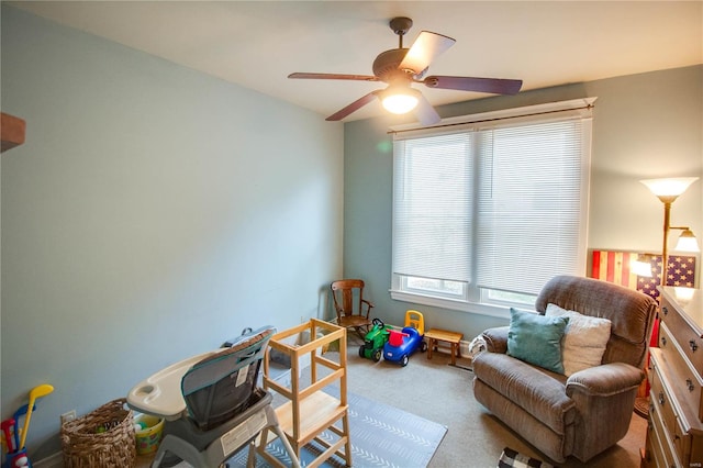 rec room with light carpet and ceiling fan