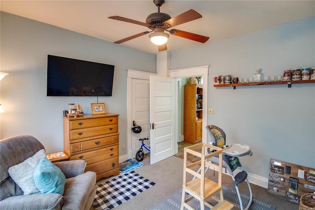 interior space featuring carpet and ceiling fan