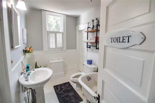 bathroom with toilet and a bathtub