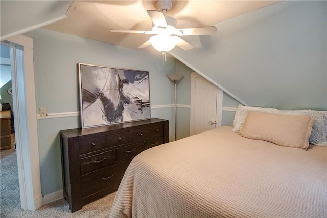 bedroom featuring light carpet, ceiling fan, and lofted ceiling