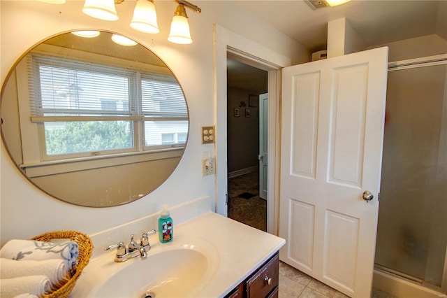 bathroom with vanity, tile patterned flooring, and an enclosed shower