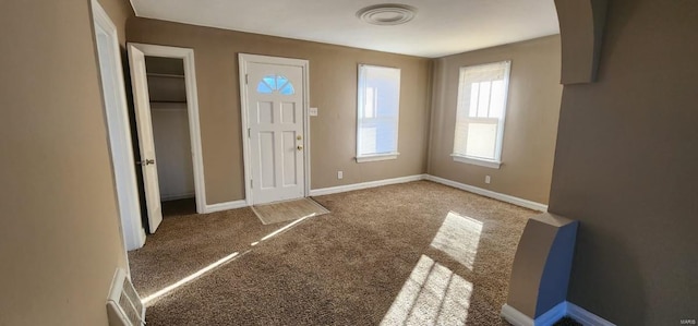 entrance foyer featuring light carpet