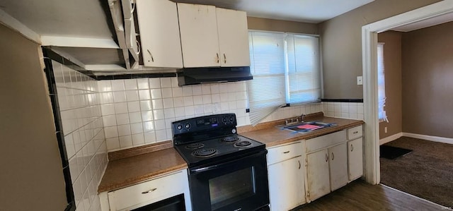 kitchen featuring black electric range oven, white cabinetry, sink, and dark wood-type flooring