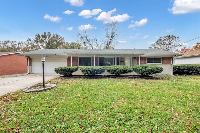 single story home with a garage and a front lawn