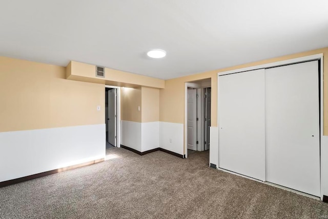 unfurnished bedroom with carpet floors