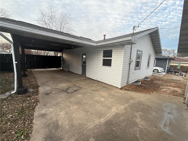 view of home's exterior with a carport