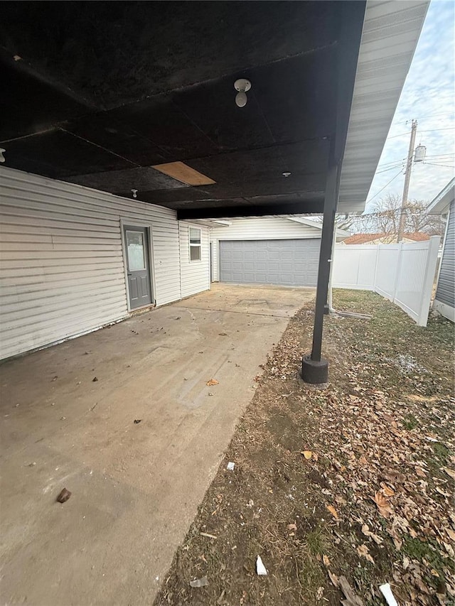 view of patio with a garage