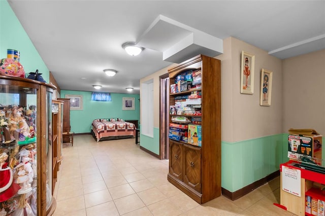 bedroom with light tile patterned floors