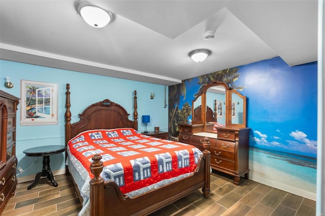 bedroom with dark hardwood / wood-style flooring