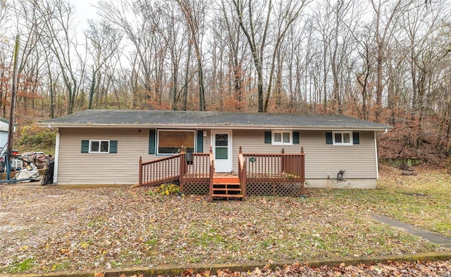 view of front of home with a wooden deck