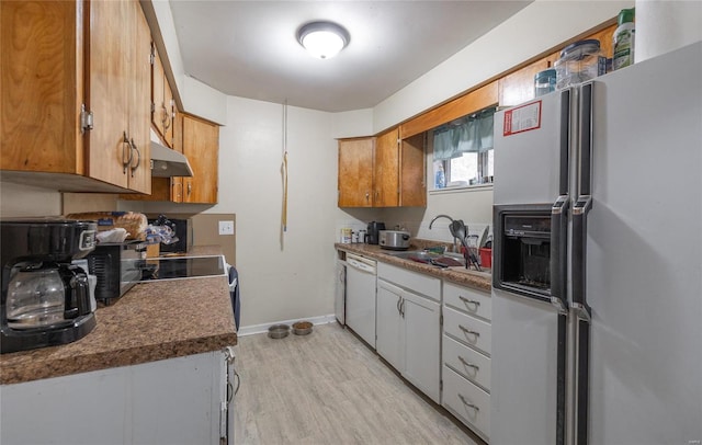 kitchen with white cabinetry, sink, white appliances, and light hardwood / wood-style flooring