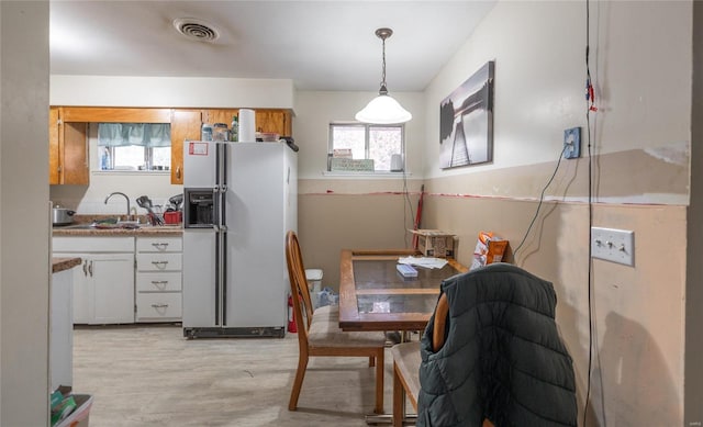 interior space with sink and light hardwood / wood-style floors