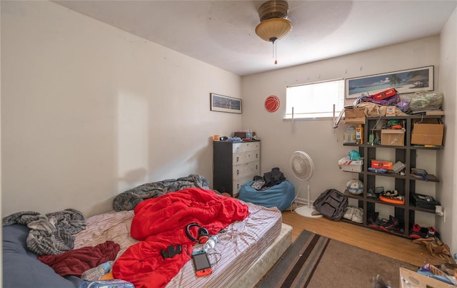 bedroom featuring hardwood / wood-style floors and ceiling fan