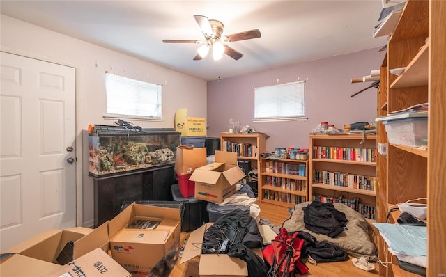 miscellaneous room with wood-type flooring and ceiling fan