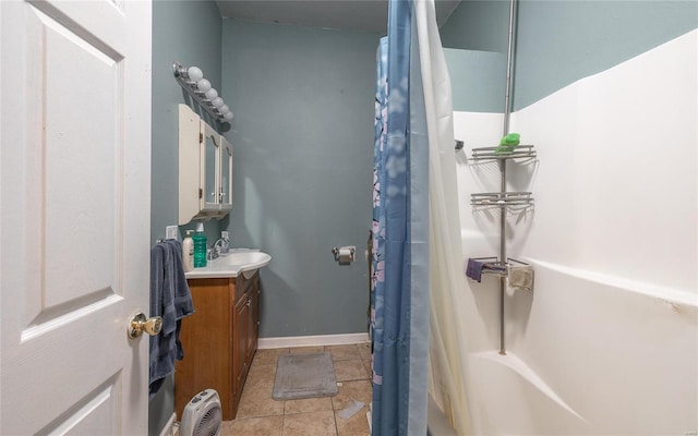 bathroom with tile patterned floors, vanity, and shower / tub combo