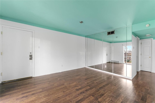 interior space with dark hardwood / wood-style flooring