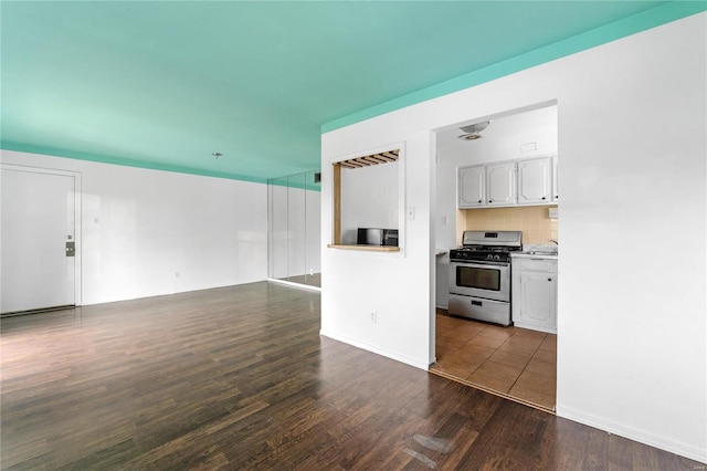 unfurnished living room featuring dark hardwood / wood-style floors