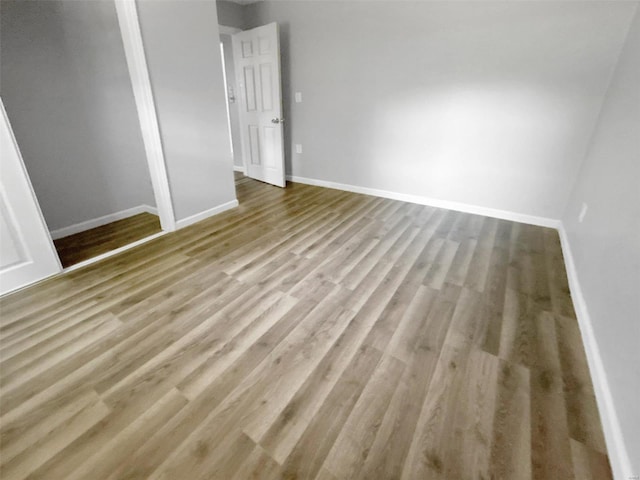 spare room with light hardwood / wood-style floors