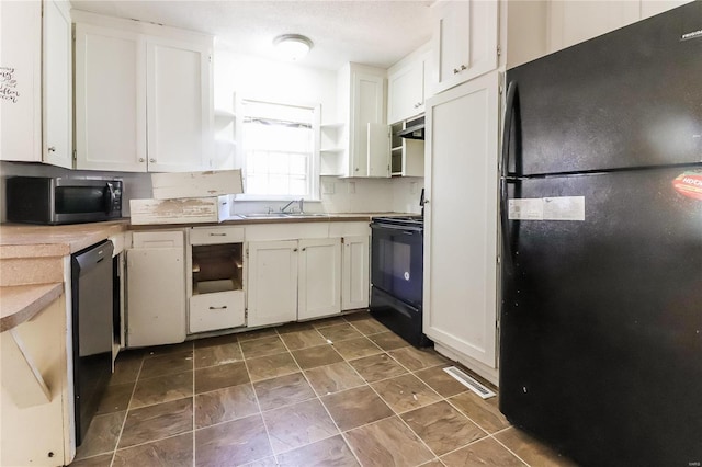 kitchen featuring extractor fan, sink, white cabinets, and black appliances